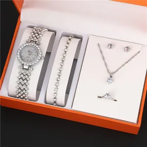 Detail view of silver 5-piece women's jewelry set with rhinestone watch and necklace