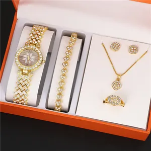 Detailed view of luxury gold 5-piece jewelry set with rhinestone watch and accessories