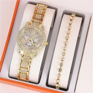 Close-up of a luxury gold ladies watch and rhinestone bracelet set in a gift box