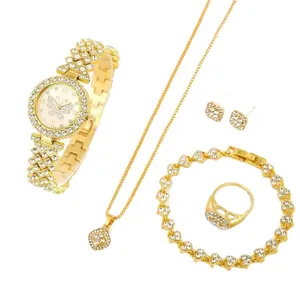 Elegant gold women's watch and rhinestone jewelry set including necklace, ring, earrings.