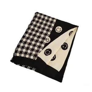Chic black and white houndstooth knitted scarf with smiley face pattern for winter warmth