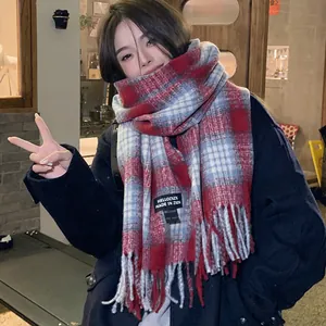Soft red and blue plaid faux cashmere winter scarf shawl worn by a stylish model