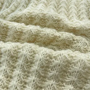 Premium off-white chunky knit wool scarf featuring a detailed star-stitch pattern for winter