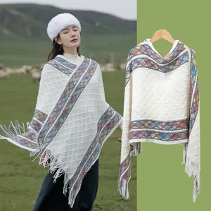 Bohemian ethnic knit shawl poncho for women with colorful stripes and decorative fringes
