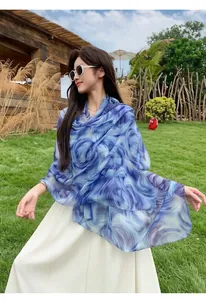 Elegant blue swirl print sun protection shawl made of lightweight Bali yarn for beach