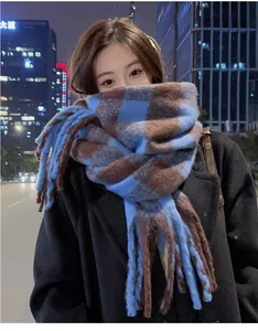 Premium blue and brown checkered mohair scarf worn by model in night city setting