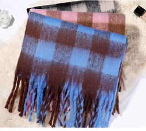 Close-up of soft mohair faux cashmere checkered scarves with long fringes in multiple colors