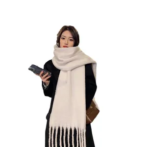 Soft white mohair-style winter scarf for women with elegant tassel detail, cozy and warm