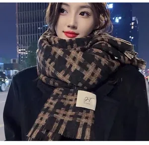 Detailed view of the checkered pattern and fabric texture of the warm winter scarf.