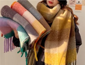 Macro view of colorful thick mohair checkered scarves with soft texture and fringes