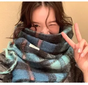 Cozy blue plaid mohair scarf for women featuring soft texture and stylish winter design.