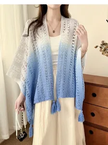 Knit poncho shawl featuring tie-dye gradient and hollow-out lace texture with tassels