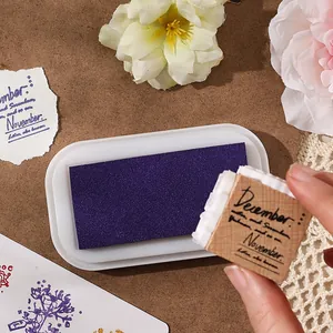 Purple high-density oil-based ink pad with artistic wooden stamp for DIY scrapbooking