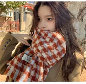 Cozy red and white plaid scarf worn by an Asian model showcasing winter fashion aesthetics