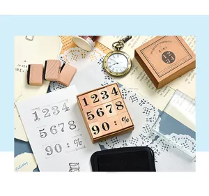 Detailed view of wooden number stamps for scrapbooking and DIY journals