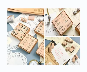 Macro view of vintage wooden stamps featuring English days, months, and numbers set.