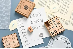 Close-up of vintage wooden stamp sets on a rustic crafting background