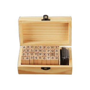 36-piece wooden stamp set with alphabet and numbers in a rustic storage box with ink pad