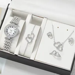 Detailed view of luxury silver rhinestone watch and double heart jewelry gift set