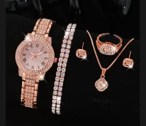 Rose gold quartz watch set with matching crystal necklace, bracelet and earrings