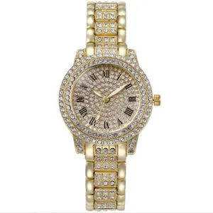 Detailed view of luxury gold-tone women's quartz watch featuring full rhinestone inlay