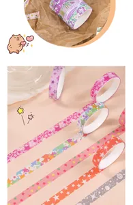 Close-up of various colorful washi tapes with star and floral patterns for journaling