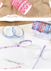 Close-up of 10-piece floral and checkered paper washi tape set on a grid notebook.