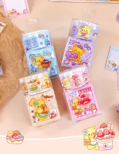 Multi-colored cute bear theme mini coil notebooks in transparent gift packaging.