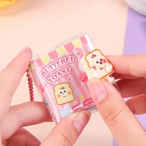 Cute mini food-themed pocket notebook keychain with cartoon buttered toast design illustration