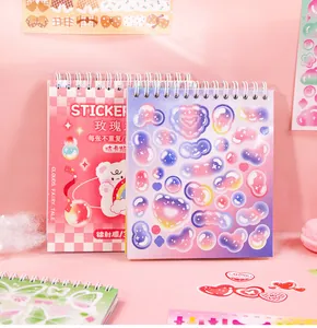 Detail view of cute Korean-style cartoon spiral sticker book for DIY journaling deco