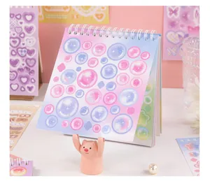 Close-up of a cute pastel bubble sticker book with 30 sheets for DIY hand accounts
