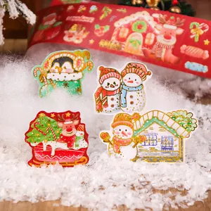 Adesivi di Natale fustellati in lamina d'oro con festosi motivi di pupazzi di neve