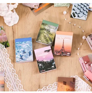 Close-up of vintage mini sticker booklets for journaling in four aesthetic colors.