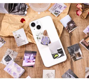 Close-up view of vintage mini collage stickers for scrapbooking and DIY phone decoration