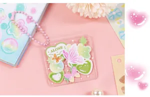 Macro view showing a cute butterfly acrylic tag used for DIY journaling decoration
