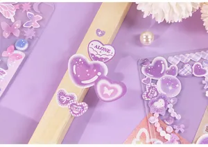 Close-up of cute purple heart and butterfly stickers for DIY scrapbooking and journals