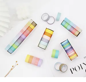 Detailed view of multiple colorful macaron washi tape sets in white gift boxes