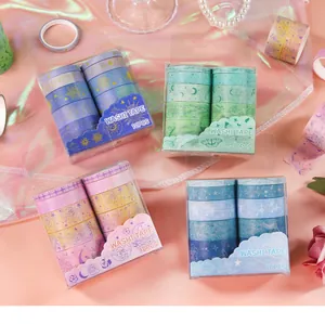 Set of 4 vintage washi tape boxes with floral, star, and butterfly patterns.