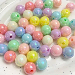 Detailed close-up of colorful iridescent AB coated acrylic round beads for DIY jewelry