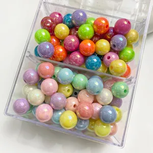 Close-up of colorful AB plated acrylic round beads in a clear plastic organizer