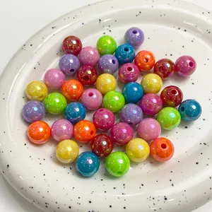 Macro shot of vibrant 6-16mm AB coated acrylic beads for DIY jewelry making crafts
