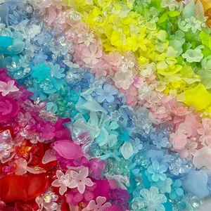 Macro detail of colorful iridescent acrylic flower and leaf beads for DIY jewelry