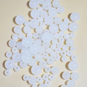 Macro view of white translucent acrylic jelly beads for DIY jewelry and craft making