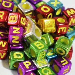 Detailed macro shot of 6mm metallic square acrylic alphabet beads for DIY jewelry making crafts