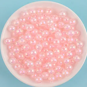 Macro view of shimmering pink 8-10mm AB acrylic beads for DIY handmade jewelry crafting