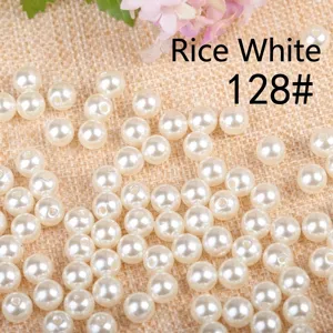 Close-up view of lustrous creamy white acrylic pearl beads for DIY jewelry making accessories