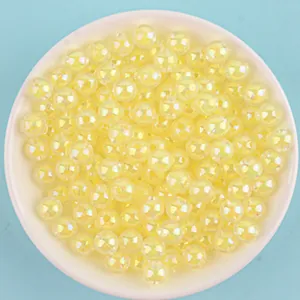 Detailed view of pale yellow AB coated acrylic beads for DIY jewelry making