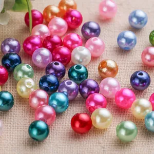 Macro detail showing colorful pearlized acrylic round beads for DIY jewelry crafts