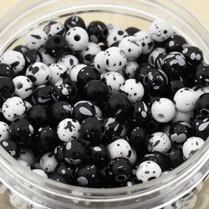 Detailed view of 8mm black and white spray-dot pattern acrylic beading accessories