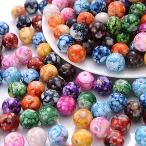 Macro detail of 8mm colorful crackle acrylic beads with unique ceramic spray effect